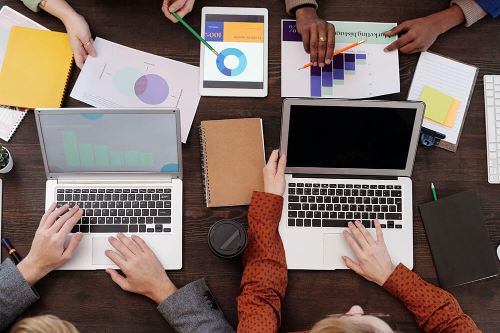 overhead photo of a digital marketing team meeting